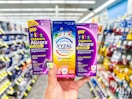 hand holding three xyzal and allegra children's allergy products