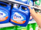 hand taking a Purex detergent container off the shelf