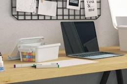 plastic storage box next to stationary items