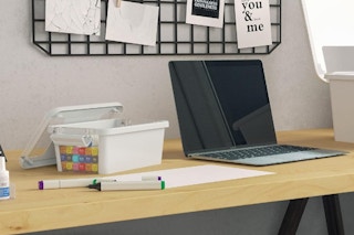 plastic storage box next to stationary items