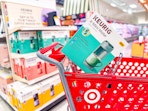 keurig coffee maker sitting on top a target cart