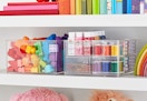 the home edit organizer on a shelf