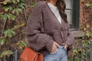Woman wearing an open front knit sweater.