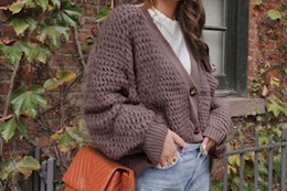 Woman wearing an open front knit sweater.