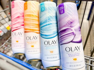 4 bottles of Olay body wash in a cart at Walmart