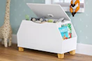 Lifestyle image of a white toy storage box in kids room setting