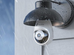 a security camera light bulb in a lamp post outside 
