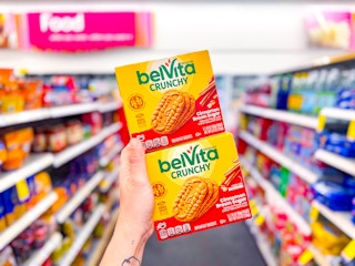 hand holding two belvita boxes