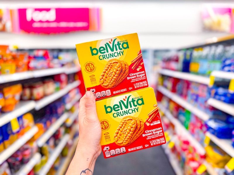 hand holding two belvita boxes