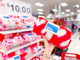 hand holding a plush valentine's day throw blanket at target