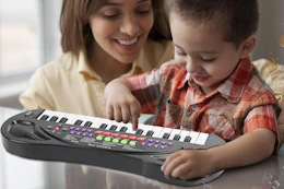 mother and child playing with piano keyboard
