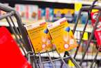 2 boxes of cvs health bandages in a cart