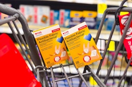 2 boxes of cvs health bandages in a cart