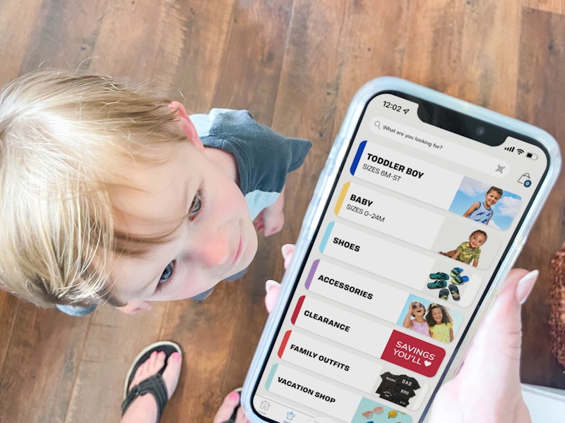 a person on a cellphone with clearance with a little boy looking up towards the food