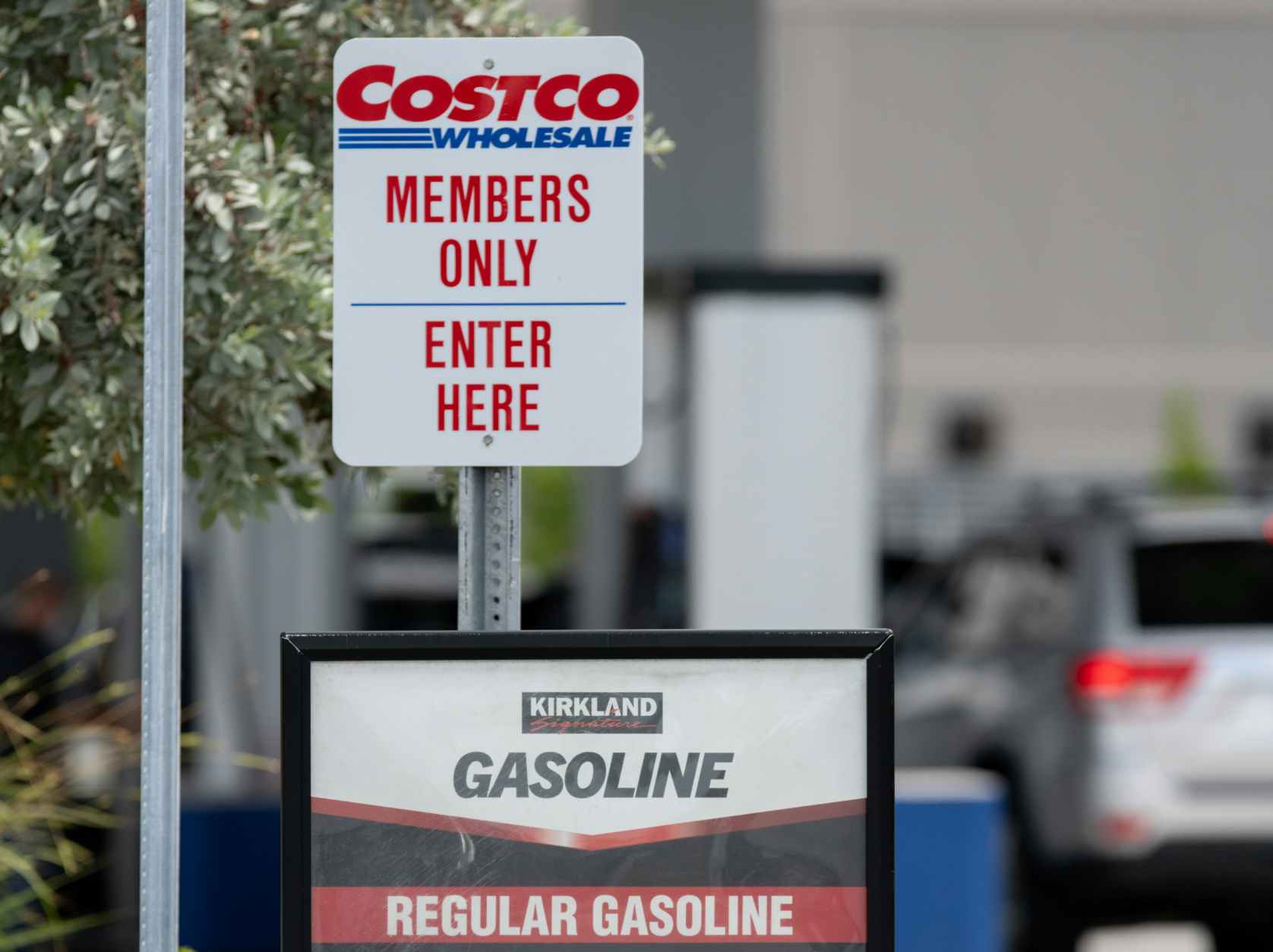 A Costco Members Only sign at the entrance of the gas station.