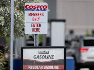 A Costco Members Only sign at the entrance of the gas station.