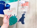 hand holding a cat & jack ice pack in front of a target shelf