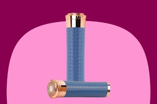 A blue and rose gold facial hair remover about the size of a tube of lipstick