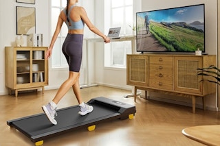 a woman using a walking pad