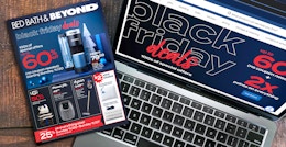The Bed Bath & Beyond 2022 Black Friday ad and a laptop showing the Black Friday deals landing page on Bedbathandbeyond.com