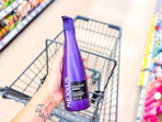 hand holding nexxus shampoo in walgreens