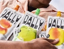 a person holding three konjac jelly puches