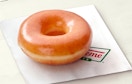Single Krispy Kreme donut on a napkin