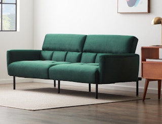 stock photo of green velvet mayview sofa bed in a living room setting