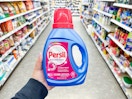 hand holding persil detergent in walgreens