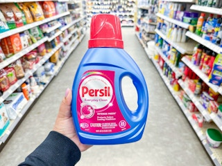 hand holding persil detergent in walgreens