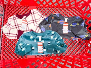 Cat and Jack sweaters in a Target shopping cart