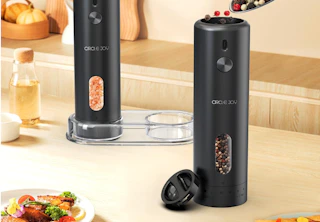 salt and pepper grinders on a counter