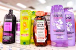 tresemme, garnier, and loreal shampoos on a shelf