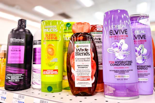 tresemme, garnier, and loreal shampoos on a shelf