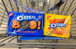 package of oreo spooky shapes and apple cider donut cookies in walmart cart
