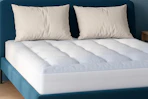 a cooling mattress protector on a bed