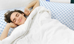 a person laying on two pillows