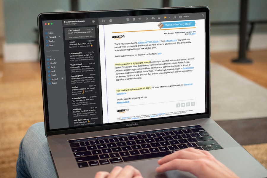 someone looking at an email about their earned digital rewards from Amazon