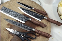 knifes on a wooden chopping block