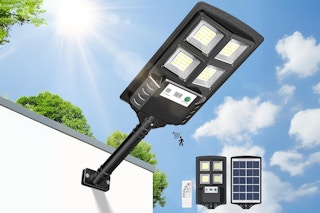 A large solar flood light with motion detection is attached to the outer wall of a building.