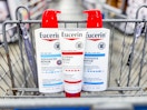 three bottles of lotion in a shopping cart