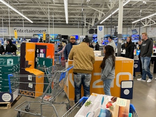 People in Walmart store during Black Friday.