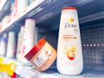 Dove body scrub and body wash on a Walmart shelf