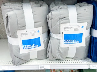 2 Room Essential quilts on shelf in Target store