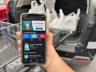 cellphone with iboota app in front of loaded car truck