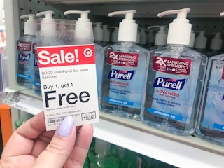 hand holding target sale tag in front of purell