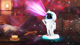 an astronaut galaxy projector on a table  