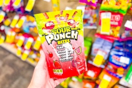 person holding a bag of sour punch bites