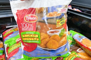 hand holding up a family pack of tyson nuggets at target