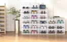 clear shoe boxes in a room against a wall